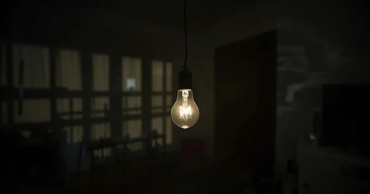 Light bulb in dark house